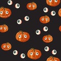 Seamless pattern with orange Halloween pumpkins carved faces and red eyed on black background. Royalty Free Stock Photo