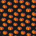 Seamless pattern of orange pumpkins on a black background. Illustration for Halloween. Fall, thanksgiving concept