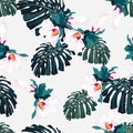 Seamless pattern with palm monstera leaves and tropical hibiscus flowers. Royalty Free Stock Photo