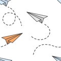 Seamless pattern with paper planes flying in different directions with a dotted trace from them. Cartoon performance. Isolated Royalty Free Stock Photo