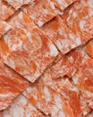 Seamless Pattern of Pastel Orange Marble Textured Tiles