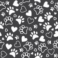 Seamless pattern with paw and heart prints. Cute animal footprint background