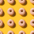 Seamless Doughnut Pattern on bright illuminating background Royalty Free Stock Photo