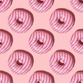 Seamless pattern of pink striped donuts on a light pink background Royalty Free Stock Photo