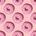 Seamless pattern of pink striped donuts on a light pink background Royalty Free Stock Photo