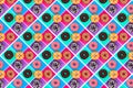 Pattern of pink, white and chocolate donuts on multi-colored background top view, tasty doughnuts colorful backdrop Royalty Free Stock Photo