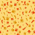 Seamless pattern with prints of hands and feet