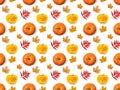Seamless pattern of pumpkins and autumn leaves on a white background. Royalty Free Stock Photo
