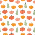 Seamless pattern with pumpkins of different shapes and colors. Autumn print for the Halloween holiday. Vector graphics. Royalty Free Stock Photo