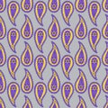 Seamless pattern with purple and yellow Paisley motifs on gray background Royalty Free Stock Photo