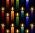 Seamless pattern with rainbow burning candles on a dark background. Vector texture Royalty Free Stock Photo