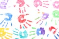 Seamless pattern with rainbow colored kids hand prints on white background Royalty Free Stock Photo