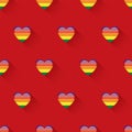 Seamless pattern of rainbow glossy heart on a red background, the concept for LGBT pattern design Royalty Free Stock Photo