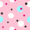 Seamless pattern with randomly scattered colored spots painted with watercolor brush. Irregular coloured polka dot.