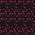 A seamless pattern of red and gold hearts scattered on a deep black background Royalty Free Stock Photo