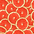 Seamless pattern of red grapefruit slices Royalty Free Stock Photo