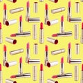 Seamless pattern of red lipstick in golden tube on yellow background isolated, shiny gold open and closed pink lipsticks, cosmetic