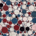 Seamless pattern of red white and blue circles packed tightly into sophisticated print