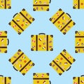 Seamless pattern with retro suitcase. Vintage baggage with stickers,flags and labels