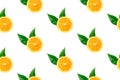 Seamless pattern from ripe juicy slices of orange with green leaves on white background. Tropical summer citrus fruits concept Royalty Free Stock Photo