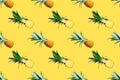 Seamless pattern of ripe pineapples isolated on yellow background. Top view Royalty Free Stock Photo