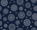 Seamless pattern with round white mandalas in snowflakes on a dark background.