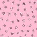 Seamless pattern with scattered small stars drawn by hand. Doodle, sketch.