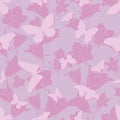 Seamless pattern with silhouettes of butterflies on a lilac background.