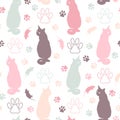 Seamless pattern with silhouettes of sitting cats