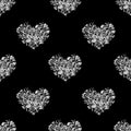 Seamless pattern silver hearts made of flower petals isolated, black background, grey shiny metal heart shape repeating ornament Royalty Free Stock Photo