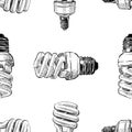 Seamless pattern of sketches of energy saving light bulbs Royalty Free Stock Photo