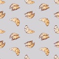 Seamless pattern of sketches fresh croissants for breakfast