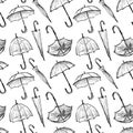 Seamless pattern of sketches various opened and closed umbrellas