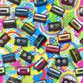 Seamless pattern with small compact cassettes on a colorful abstract background with circles and stars. Royalty Free Stock Photo