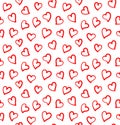 Seamless pattern with small red hand drawn hearts on the white background. Royalty Free Stock Photo