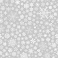 Seamless pattern of snowflakes, white on gray