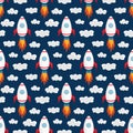 Seamless pattern with space rockets on the blue background.