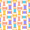 Seamless pattern, spools of thread in different colors on a white background. Print, textile, background Royalty Free Stock Photo