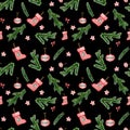 Seamless pattern with spruce branches,red toys, Christmas boot. Isolated on black. Watercolor