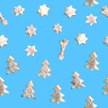 Seamless pattern. Stock New Year illustration with shortbread cookie isolated on a blue background. Baking is sprinkled with sugar