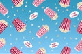 Seamless pattern with striped popcorn box, popcorn grains. Movie junk food. Vector illustration Royalty Free Stock Photo
