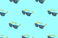 Seamless pattern. Sunglasses on pastel blue background. Minimal summer concept. Flat lay. Use for t-shirt, greeting cards, Royalty Free Stock Photo