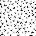 Seamless pattern with swallows silhouettes .