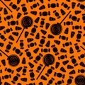 Seamless pattern with sweets. Halloween holiday background. Trick or treat wallpaper. Repeated candy silhouettes print