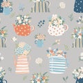 Seamless pattern with teapots and jugs with flowers. Perfect background for home design