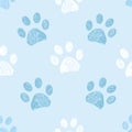 Seamless pattern for textile design. Blue and white colored paw print pattern