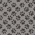 Seamless pattern for textile design. Doodle black paw print with grey background Royalty Free Stock Photo