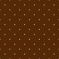 Seamless pattern, texture or background with white polka dots on brown background