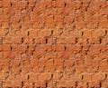 Seamless pattern. The texture of the old broken brick. Copper color.