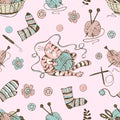 Seamless pattern on the theme of knitting with a basket and balls of yarn and a cute cat. Vector Royalty Free Stock Photo